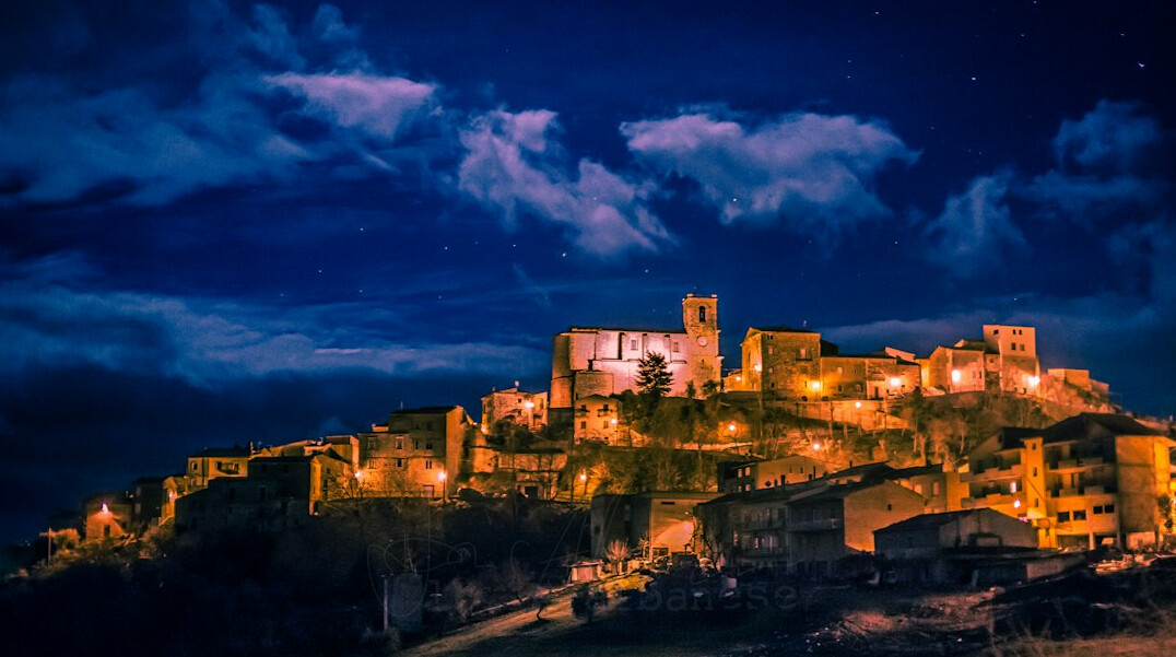 Night sky over a historic old town