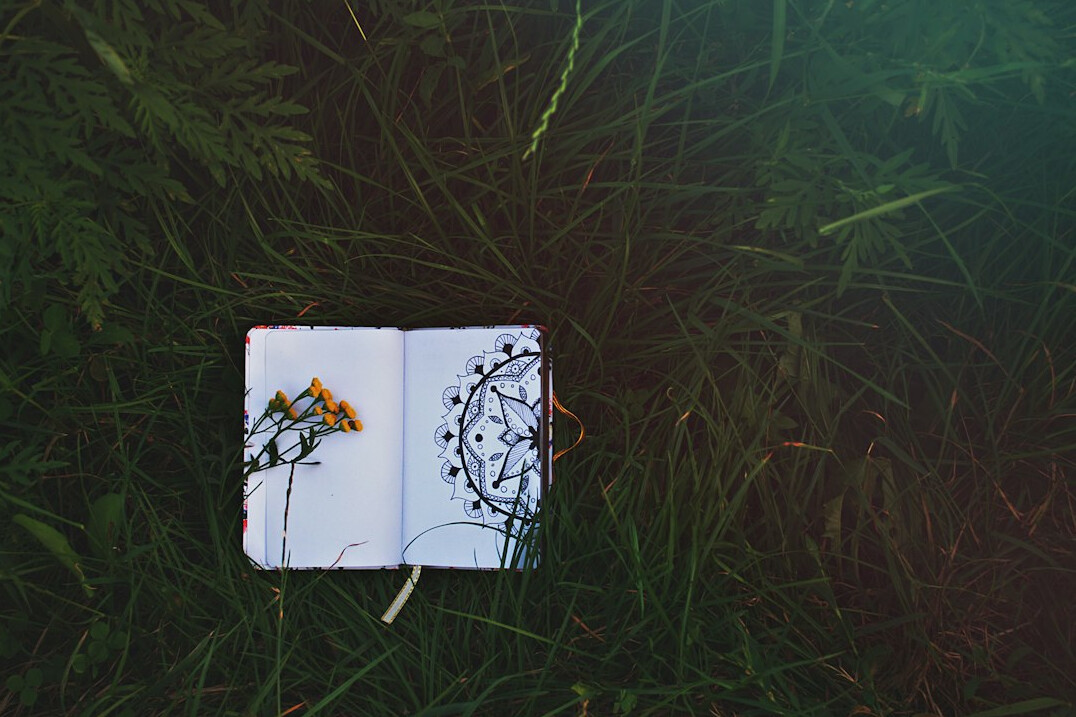 Notebook and pen on a wooden desk