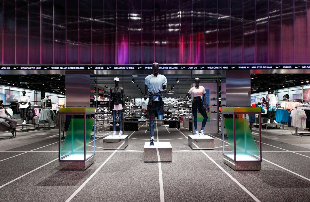 store detective monitoring clothing racks