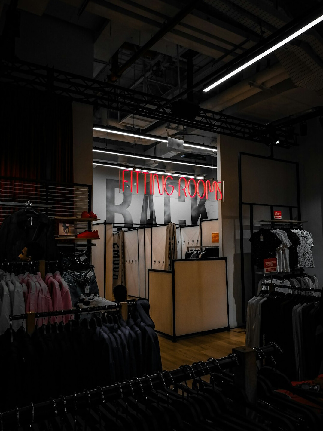 shoplifter trying on clothes in fitting room